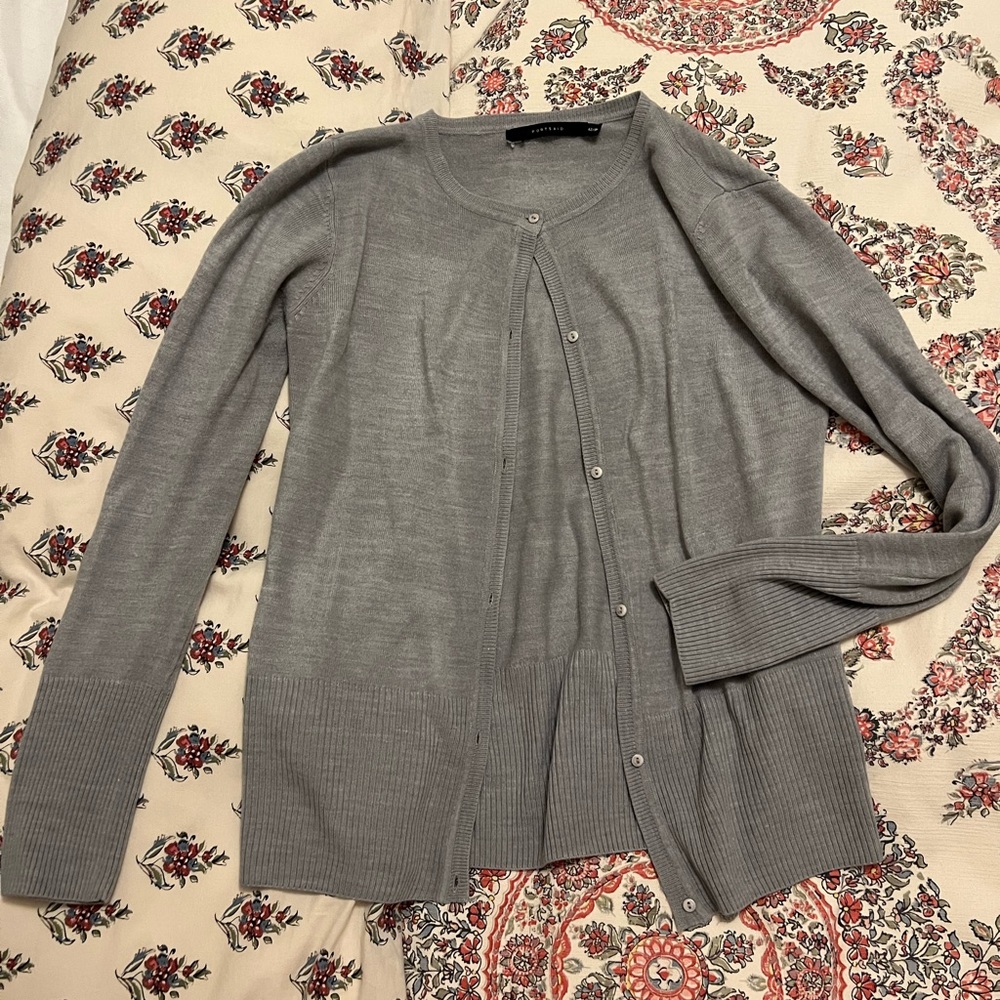 Light gray cardigan with ribbed bottom and sleeve end. Size small.